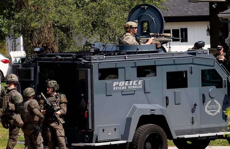 Law enforcement from area departments surround a home on Thursday, June 5, 2025, in the area of Venice Avenue and Court Street in McHenry.