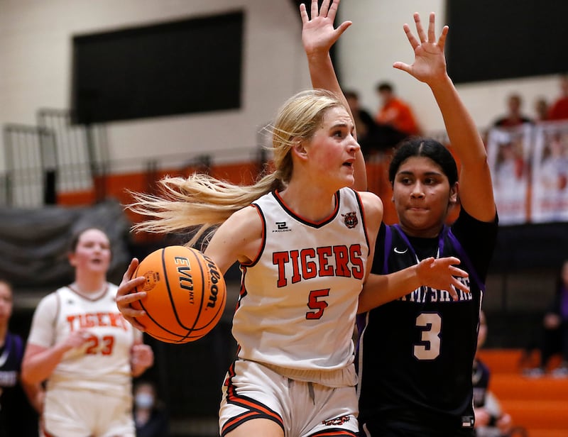 Crystal Lake Central's Ruby Macke drives to the basket against Hampshire's Jiselle Lopez during a Fox Valley Conference basketball game on Friday, Feb. 7, 2025, at Crystal Lake Central High School.