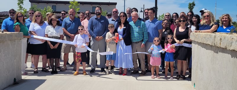 Sterling city officials and Riverfront Commission members and donors cut the ribbon Saturday to officially open the Northwestern Steel & Wire Park.
