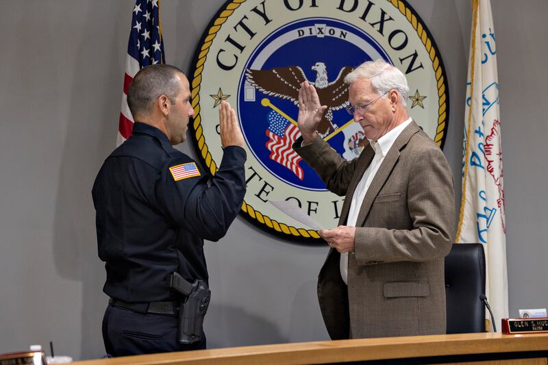 Dixon police’s Aaron Simonton is sworn in as the department’s new deputy chief Monday, August 18, 2025, by Dixon mayor Glen Hughes.