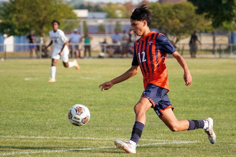 Oswego’s Enrique Castaneda III (12) plays the ball during a soccer match Batavia at Oswego High School on Thursday, Sep 12, 2024.