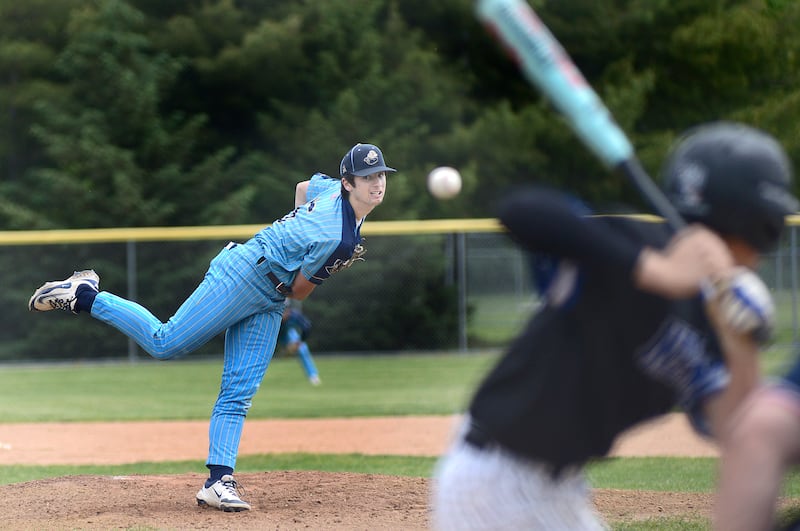 Marquette’s Alex Novotney fires a pitch Saturday against Newark pitching a complete game allowing 1 run at Masinelli Field.
