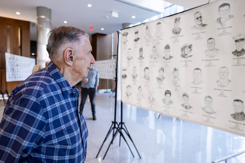 Crest Hill resident Frank Rzonca takes in the 'Portrait of a Soldier’ exhibit at the Will County Courthouse in Joliet, Illinois, on Sept. 11, 2025.