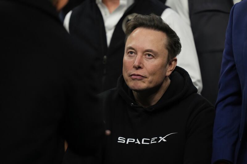 FILE - Elon Musk attends the finals for the NCAA wrestling championship, Saturday, March 22, 2025, in Philadelphia. (AP Photo/Matt Rourke, File)