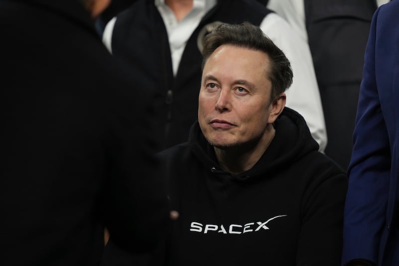 FILE - Elon Musk attends the finals for the NCAA wrestling championship, Saturday, March 22, 2025, in Philadelphia. (AP Photo/Matt Rourke, File)