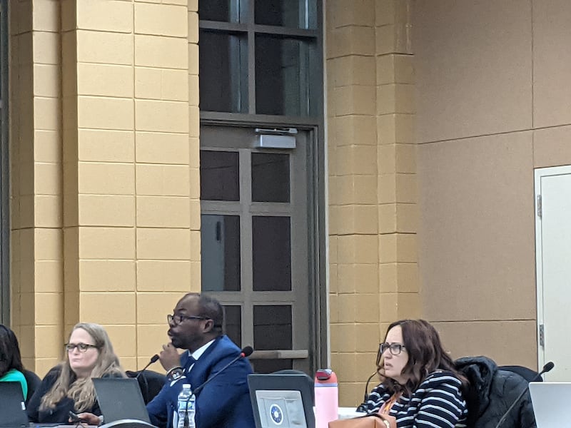 Oswego School District 308 chief financial officer and chief school business official Raphael Obafemi, center, talks about the district's financial situation at the March 23, 2026 School Board meeting.