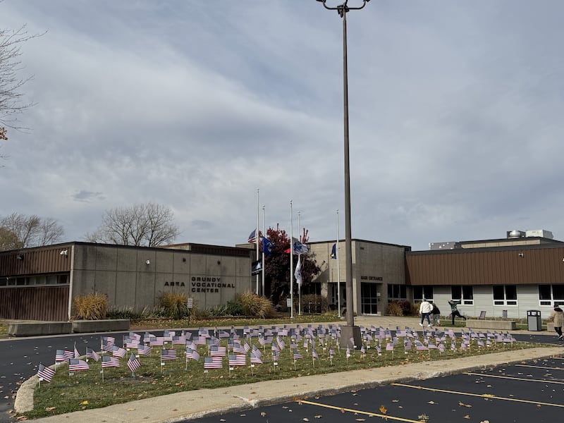Many American flags honoring veterans cover the front lawn at the Grundy Area Vocational Center on Tuesday, Nov. 11, 2025.