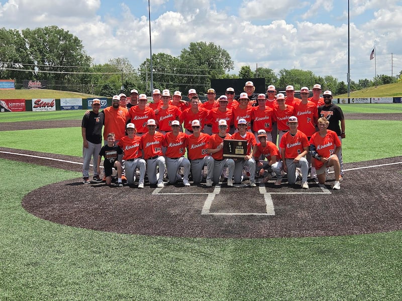 The Minooka baseball team celebrates its Class 4A Normal Community Sectional title on Saturday.