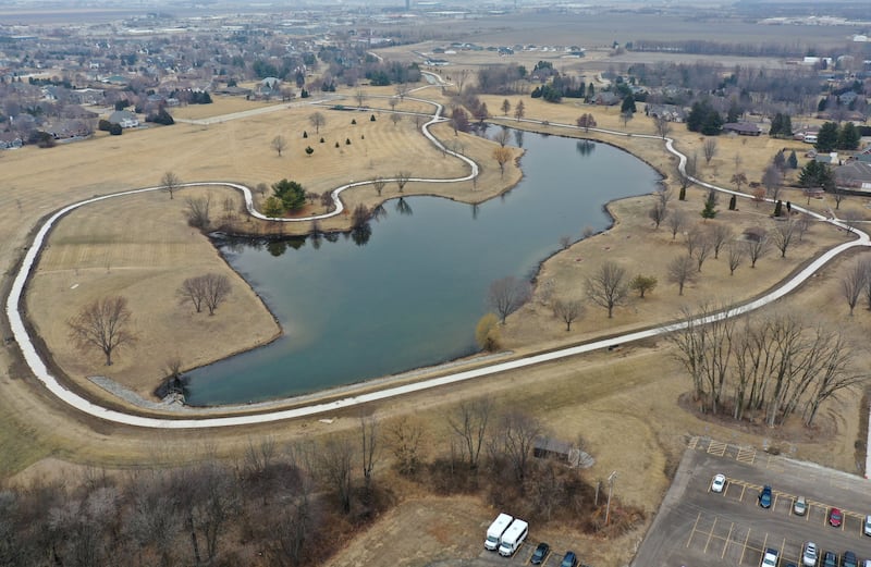 An aerial view of Baker Lake on Tuesday, March 3, 2026 in Peru. The walking path has been completed around the lake and crews are working at the site. The lake has been closed to the public for five months.