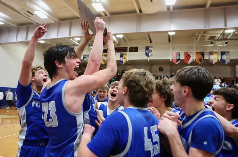 Princeton senior Noah LaPorte celebrate their 59-53 regional championship victory Seneca at Prouty Gym Friday night. It was Princeton's fourth straight regional title.