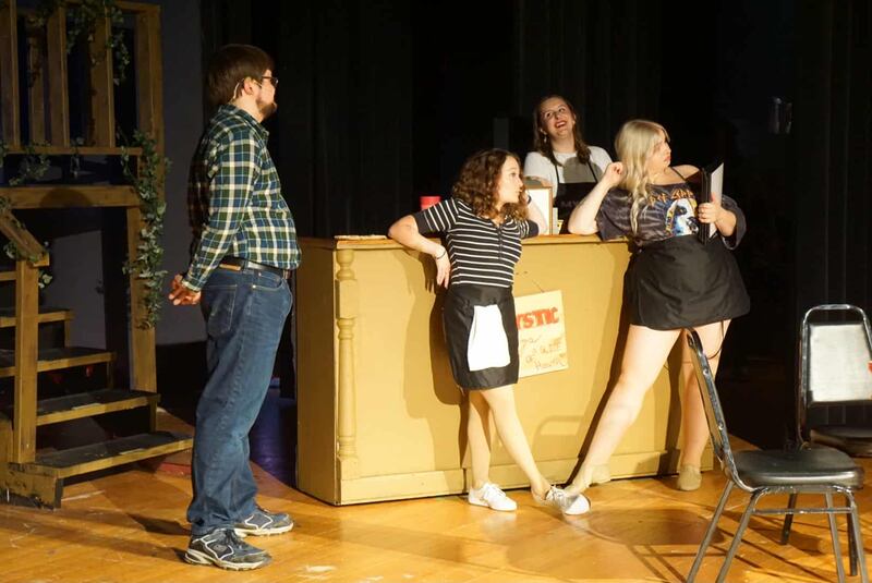 Cast members rehearse a scene from Engle Lane Theatre’s upcoming production of Mystic Pizza: The Musical, which opens Sunday, Oct. 5, in Streator.