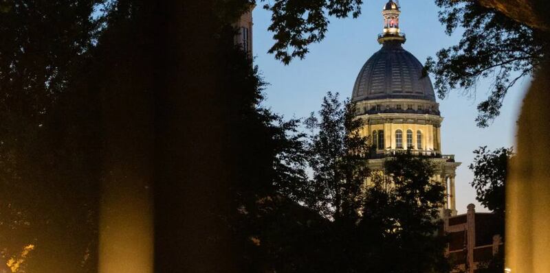 The Illinois Capitol, as seen from the lawn of the governor’s mansion a few blocks away in late May 2025.