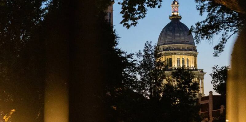 The Illinois Capitol, as seen from the lawn of the governor’s mansion a few blocks away in late May 2025.