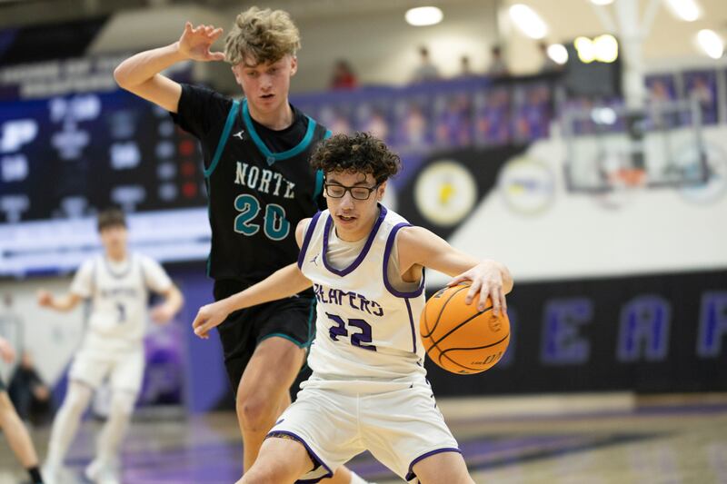 Plano's Jayden Zepeda dribbles the ball in front of a Woodstock North defender during Friday's game in Plano.