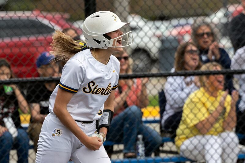 Sterling’s Marley Sechrest celebrates a two-run double by teammate Sterling’s Lily Martinez against Moline Tuesday, April 22, 2025.