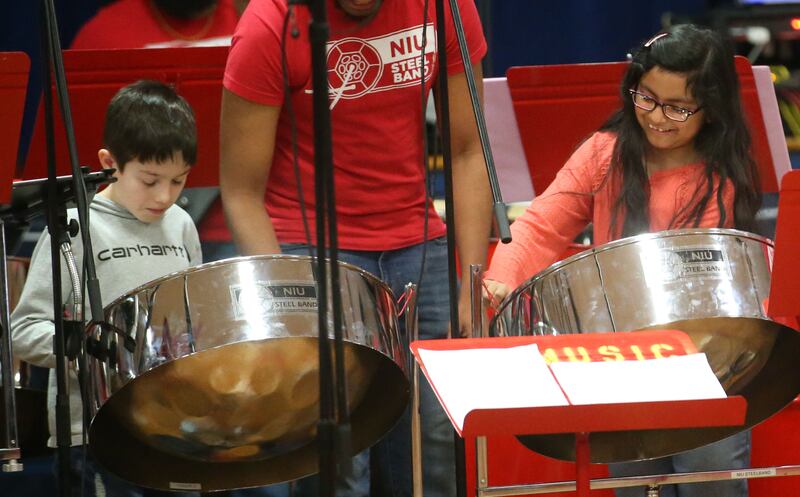 DePue students Colten Rivers and Rosie Caracheo play steelpans with the NIU Steelband on Friday, Feb. 14, 2025 at DePue School.