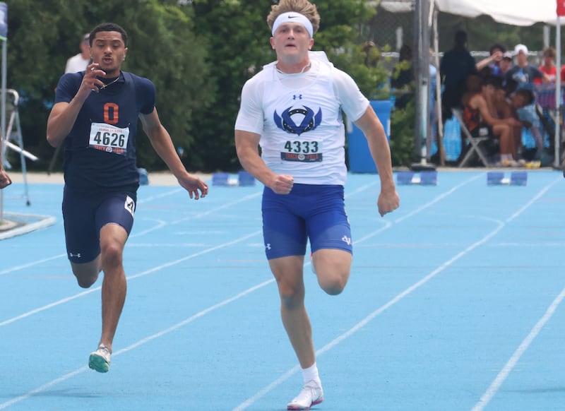 Oswego's Dontrell Young and Geneva's Mason Halbach race in the Class 3A 100 meter dash during the IHSA State Track and Field championship on Saturday, May 30, 2026 in Charleston.