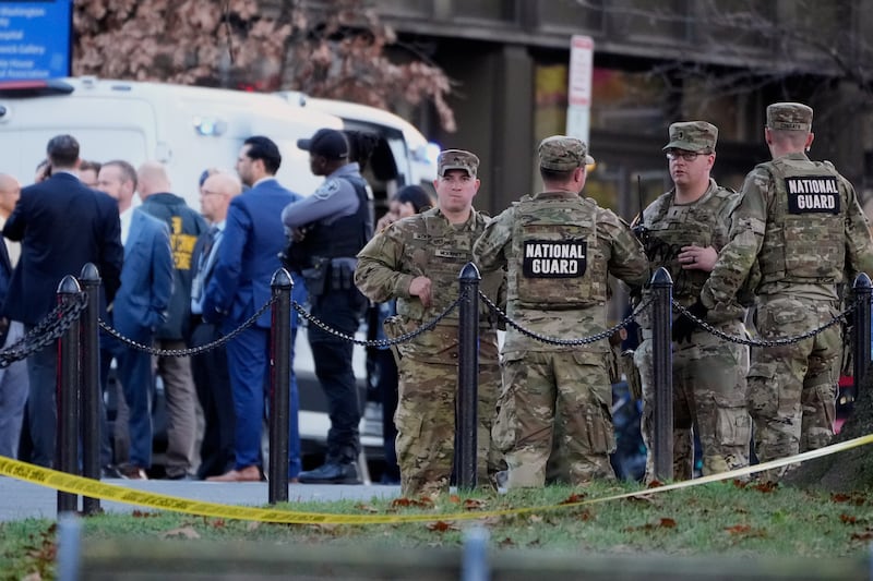 Emergency personnel gather in a cordoned off area where National Guard soldiers were shot near the White House Wednesday, Nov. 26, 2025, in Washington. (AP Photo/Mark Schiefelbein)