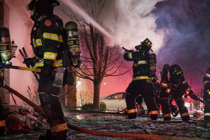 Crews battle a large fire that engulfed a Cary home on Dec. 31, 2025. A dog was missing after the blaze.