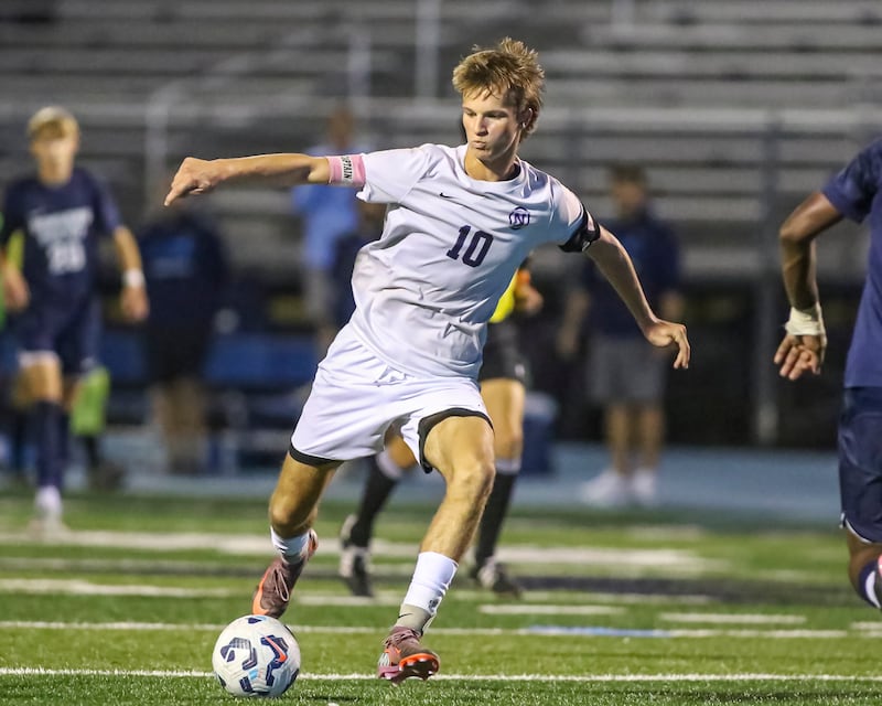 Downers Grove North's Oliver Davies (10) kicks on goal during soccer match between Downers Grove North at Downers Grove South. Oct 2, 2025.