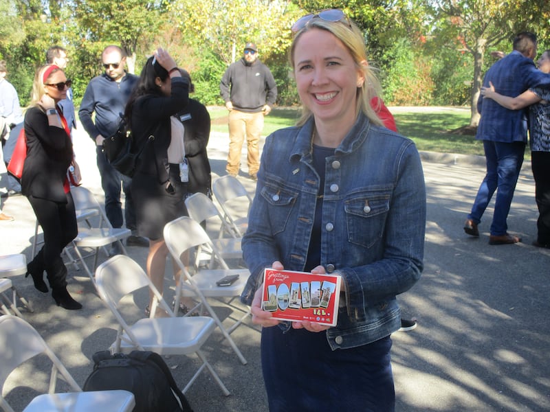 Joliet City Planner Jayne Bernhard displays postcards designed to enhance the city's appeal as a desitnation for Route 66 tourists. Oct. 23, 2024