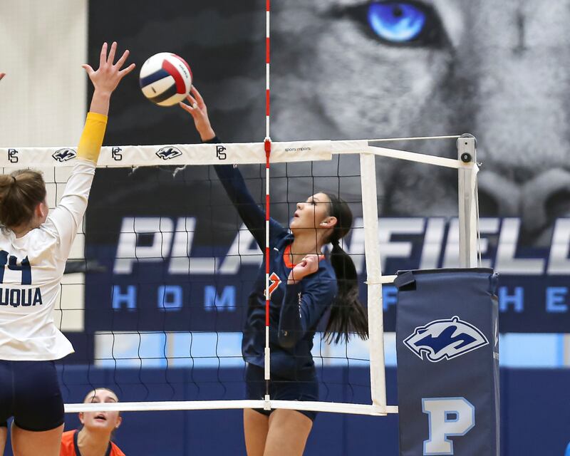 Oswego's Hannah Herrick (7) taps the ball over the net during Class 4A Regional Final volleyball match between Neuqua Valley at Oswego. Oct 30, 2025 in Plainfield.