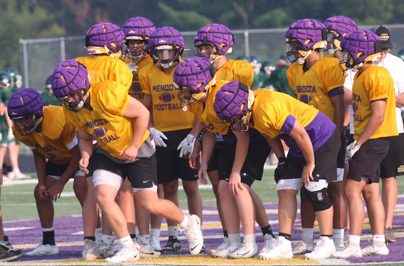 Members of the Mendota football team huddle during a joint practice on Thursday, July 31, 2025 at Mendota High School.
