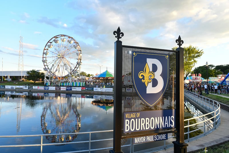 Carnival rides surround the Bourbonnais Municipal Center Pond during the first day of the 49th Bourbonnais Friendship Festival in 2024.