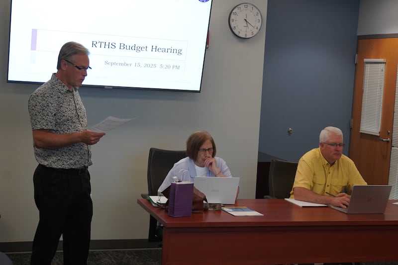 Rochelle Township High School District Business Manager Kevin Dale speaks during the board's budget hearing on Sept. 15, 2025. Pictured at center is Board Member Janet Kacvinsky and at right is Board Member Joel Thompson.