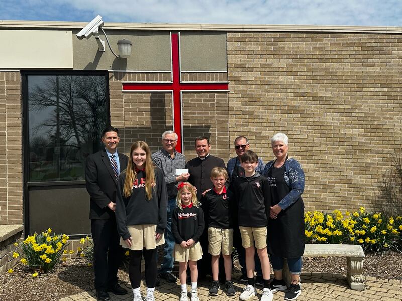 Oglesby Knights of Columbus presented a check for $1,500 to Holy Family School on Thursday, April 10 at the school. Pictured from left are students Elyse Grubich, Gianna Holt, River Rubley and Liam Tutaj. In the back row are Principal Nathan Boudreau, Knights of Columbus member Dan Gregorich, the Very Rev. Paul Carlson, and Knights of Columbus member Ken Stopa and Donna Stopa.