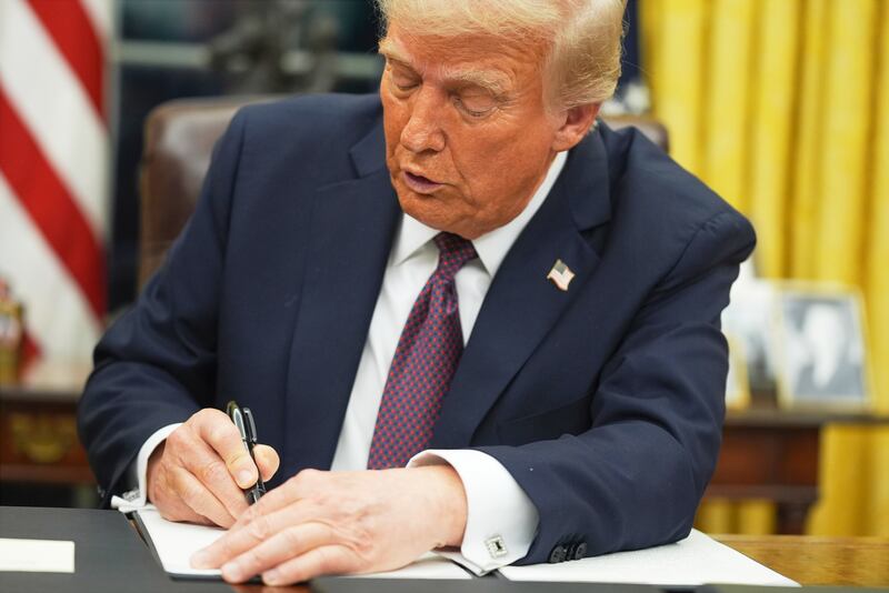 FILE - President Donald Trump signs an executive order on birthright citizenship in the Oval Office of the White House in Washington, Jan. 20, 2025. (AP Photo/Evan Vucci, File)