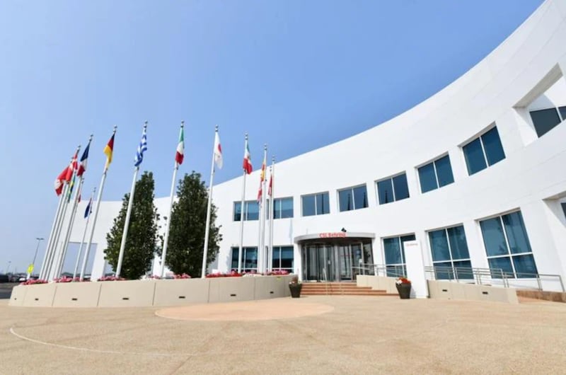Flags from across the globe fly above the entrance to CSL Behring in Kankakee County.