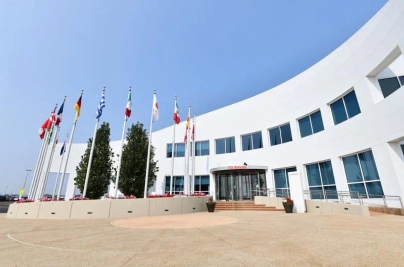 Flags from across the globe fly above the entrance to CSL Behring in Kankakee County.