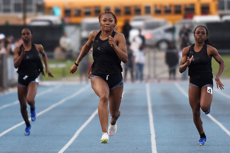 Kankakee's Naomi Bey-Osborne, center, beats a pair of Kays teammates to the finish line of the 200 m dash at the All-City track and field meet at Kankakee Monday, April 28, 2025.