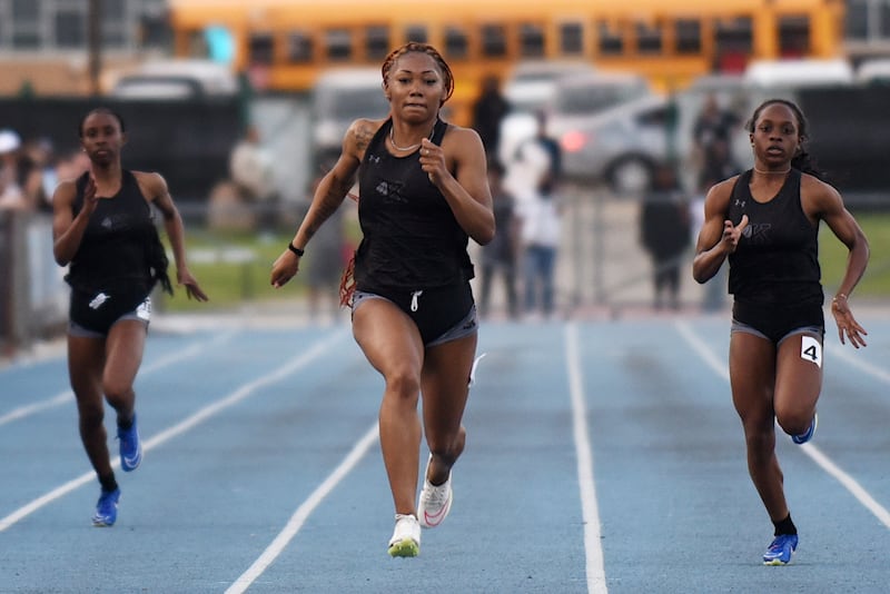 Kankakee's Naomi Bey-Osborne, center, beats a pair of Kays teammates to the finish line of the 200 m dash at the All-City track and field meet at Kankakee Monday, April 28, 2025.