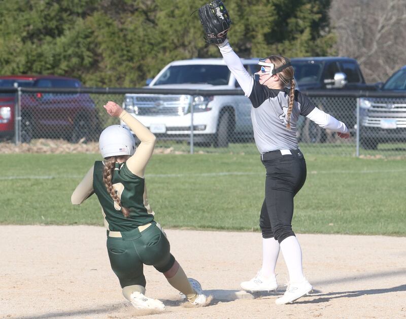 Woodland/Flanagan-Cornell second baseman Aubry Edens (4) makes a catch at second base to force out St. Bede baserunner Maci Kelly on Tuesday, April 8, 2025, at Woodland School in rural Streator.