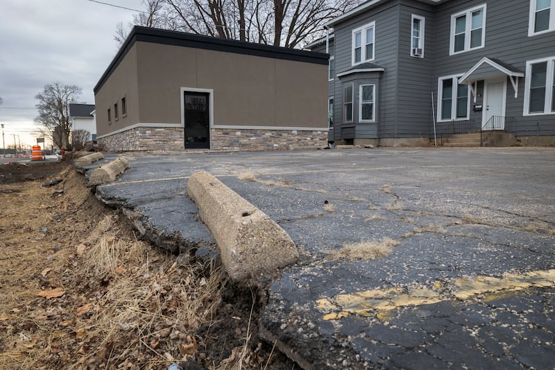 A parking lot located at 502 E. Second Street in Sterling is seen Monday, March 2, 2026. Liven Holdings is rehabbing the building are asking for the city's help to fix the adjacent parking lot.