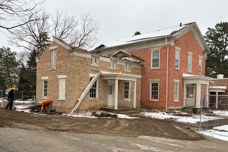 Demolition work begins is underway on Dec. 31, 2025, at the Academy Building in Crystal Lake, built in the 1850s. Hopes of moving the structure off the property of the church that owns in were dashed when it was deemed unfeasible.
