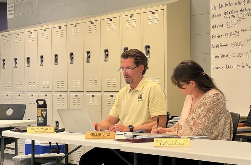 Sycamore Superintendent Steve Wilder, whose employment contract was amended by the board of education in June, looks over his notes alongside board secretary Kellie Vinz on June 24, at Sycamore Middle School.