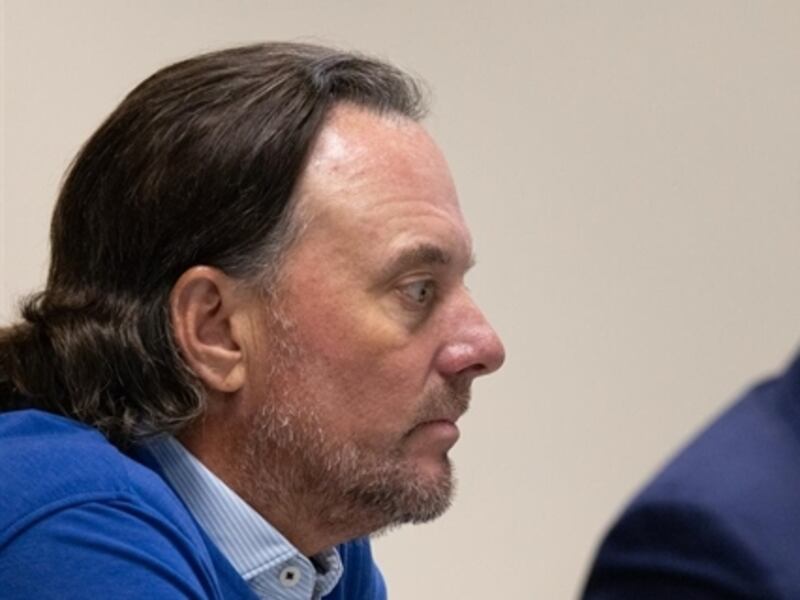 Conservative political operative Dan Proft (left) listens to testimony from former Republican gubernatorial candidate Darren Bailey (right) in a hearing over allegations that the two illegally coordinated messaging campaigns in 2022.