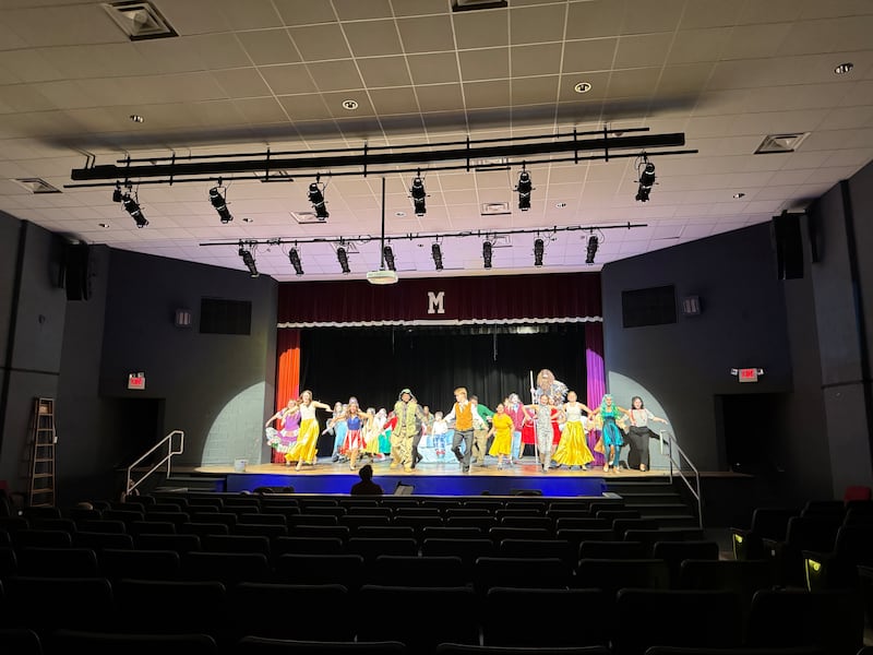 The cast of Morris Community High School's performance of "Big Fish" dances and sings on stage during a rehearsal on Monday, April 28, 2025.