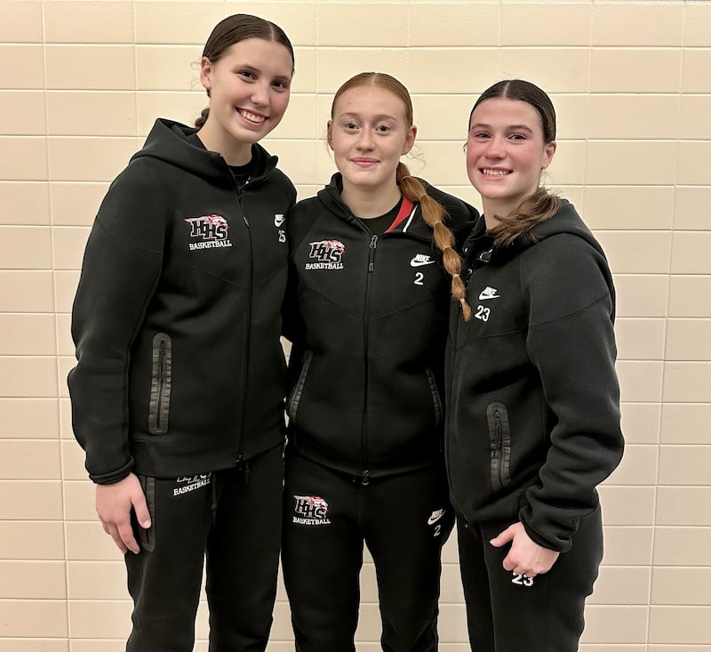 Evie Freundt (left) and Aubrina Adamik (right) each finished in double figures, while Avery Suess (middle) pushed through a knee injury during Huntley's IHSA 4A sectional semifinal against Libertyville on Tuesday.