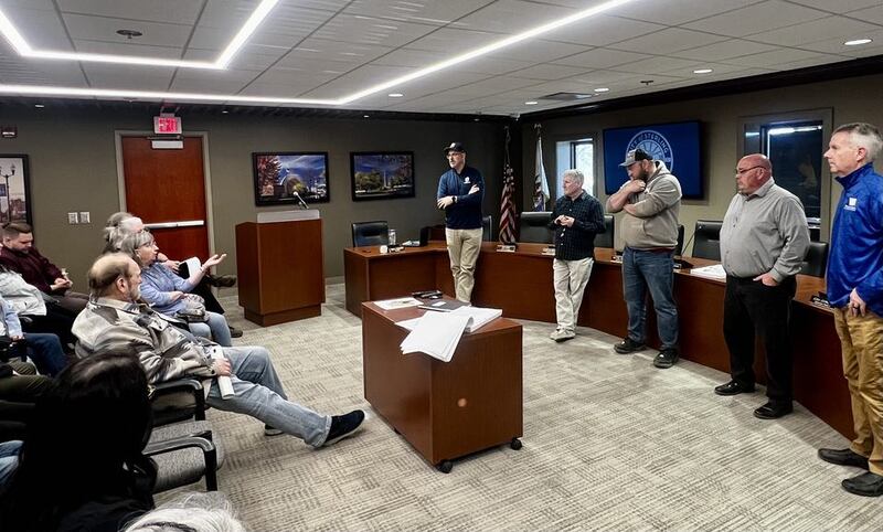 Pam Machan asks engineer Kyle Lorenz a question about Sterling's Second Street road construction project during an open house at Sterling's City Hall on April 8, 2025.