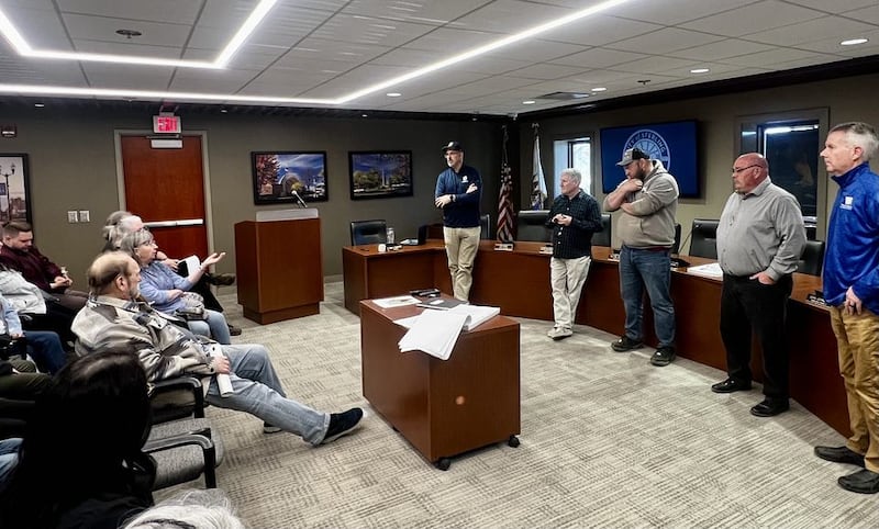 Pam Machan asks engineer Kyle Lorenz a question about Sterling's Second Street road construction project during an open house at Sterling's City Hall on April 8, 2025.
