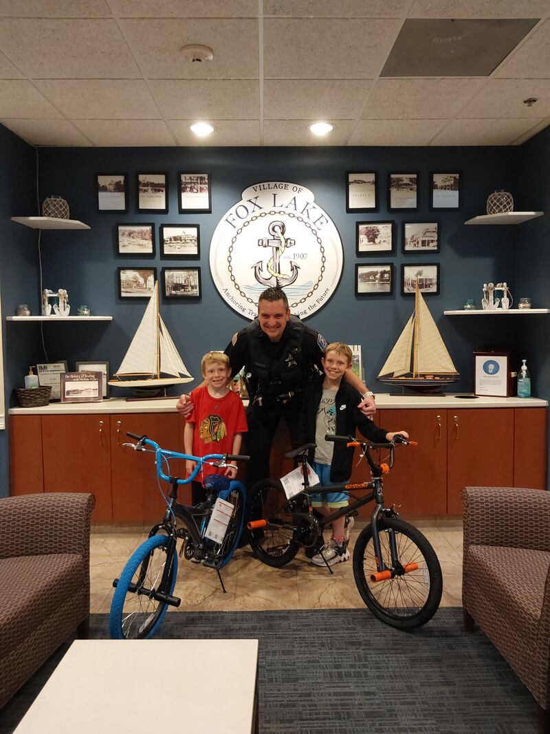 Trey and Connor Stewart of Wonder Lake met with Officer Cawley, who is the school resource officer and a bike patrol officer, on June 18 to show off their new bikes.
