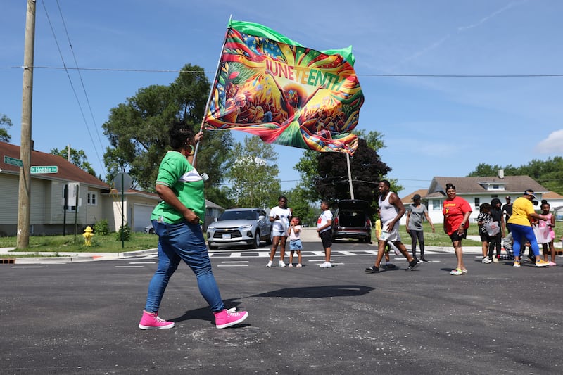Spectators gather along Hobbie Avenue to watch the Kankakee Juneteenth Parade on Saturday, June 21, 2025.