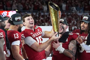 Indiana completes undefeated season and wins first national title, beating Miami 27-21 in CFP final