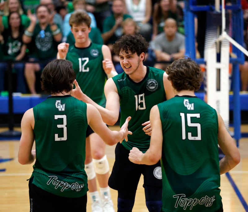 Glenbard West's Otis Yahn (19) reacts after a point with his teammates Andrew Fanella (3) Lukas Wallin (15) and Henry Truitt (12) during the championship match of the IHSA State Final Boys Volleyball Tournament Saturday, June 7, 2025 in Hoffman Estates.