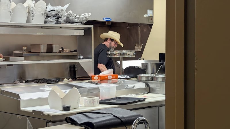 Tom Grotovsky, owner of The Curator’s Café inside the inside the American Legion Post 1080 in Joliet, is seen filling orders on Bluegrass Burger Bash Day, Wednesday, April 30, 2025.