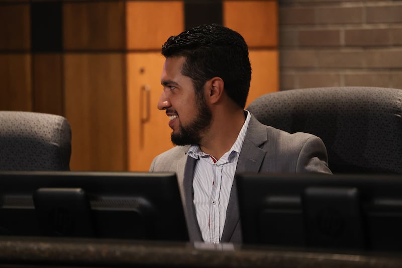 Joliet City Council member Cesar Guerrero has a conversation before the start of the Joliet City Council meeting on Tuesday, July 18, 2023.